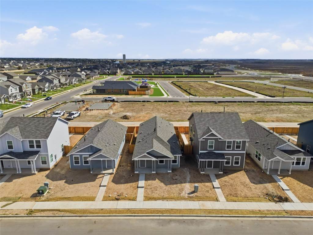 596 Sormonne Loop Kyle, TX 78640 - Photo 23 of 25 an aerial view of residential houses with outdoor space