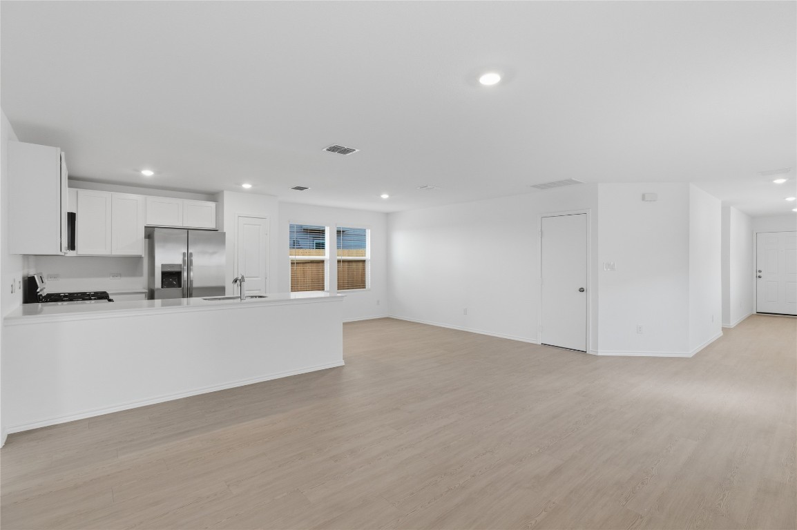 596 Sormonne Loop Kyle, TX 78640 - Photo 4 of 25 a view of a kitchen with a sink