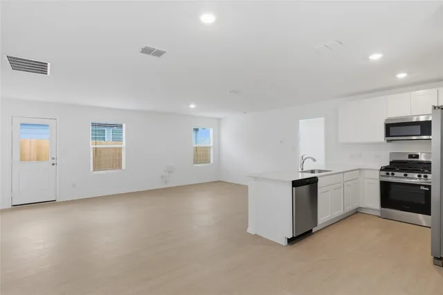 an aerial view of a table and chairs