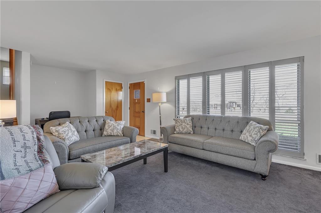 1606 Old Brodhead Road Monaca, PA 15061 - Photo 12 of 37 a living room with furniture and a large window