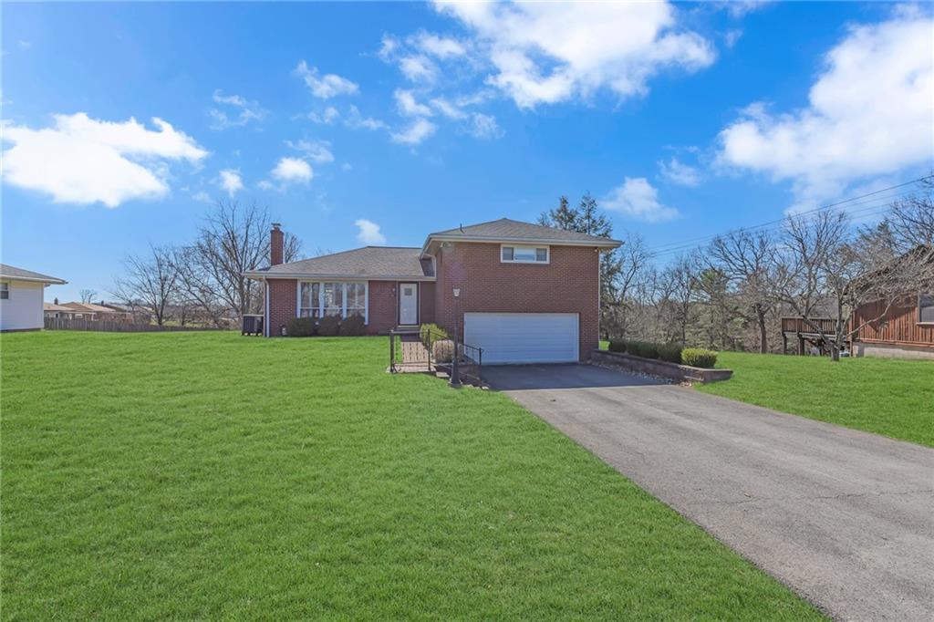 1606 Old Brodhead Road Monaca, PA 15061 - Photo 2 of 37 a house view with a garden space