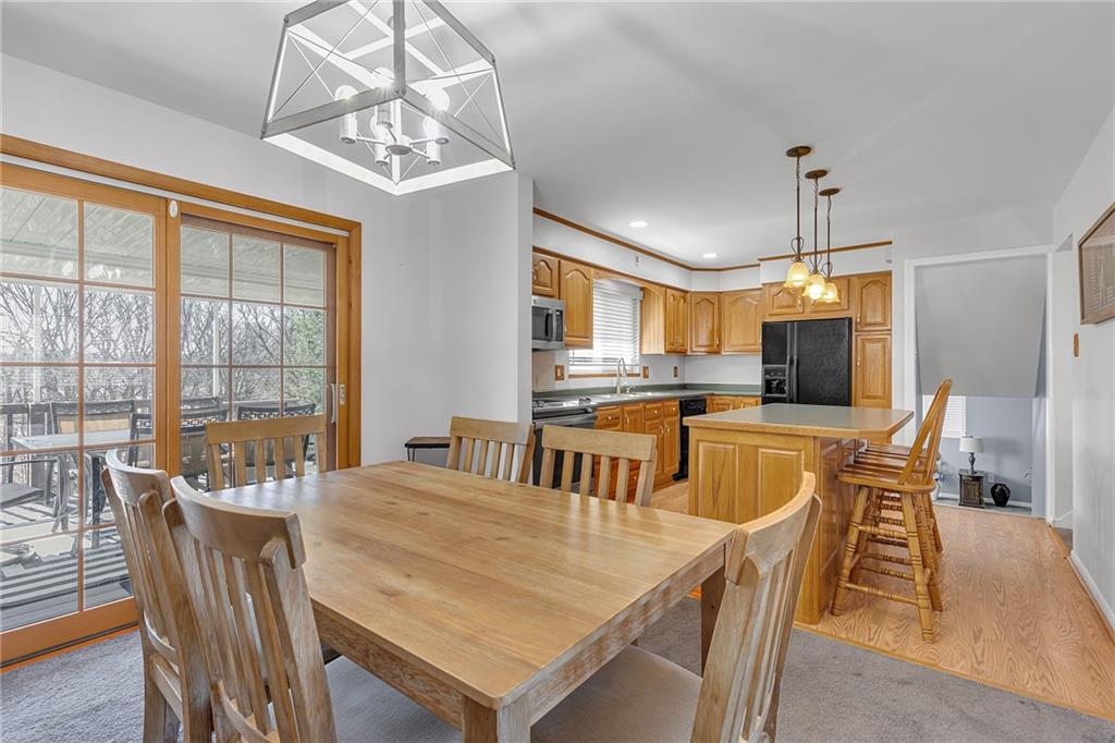 1606 Old Brodhead Road Monaca, PA 15061 - Photo 21 of 37 a dining room with furniture a chandelier and wooden floor