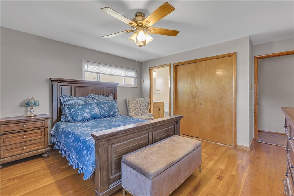 1606 Old Brodhead Road Monaca, PA 15061 - Photo 25 of 37 a bedroom with a bed and a chandelier