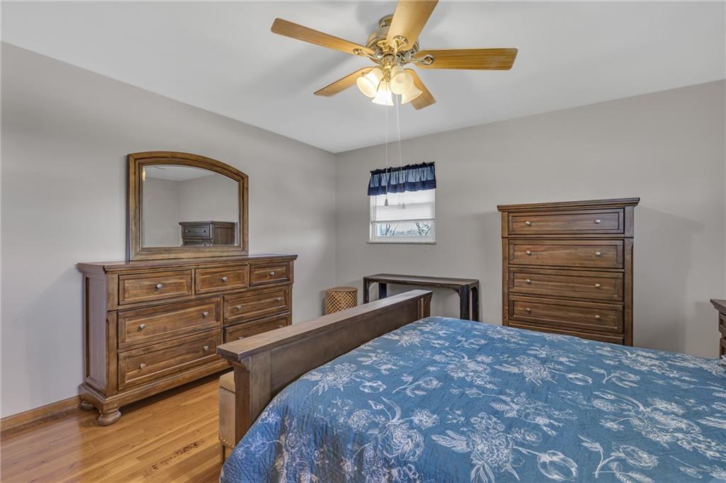 1606 Old Brodhead Road Monaca, PA 15061 - Photo 26 of 37 a bedroom with a bed and a dresser