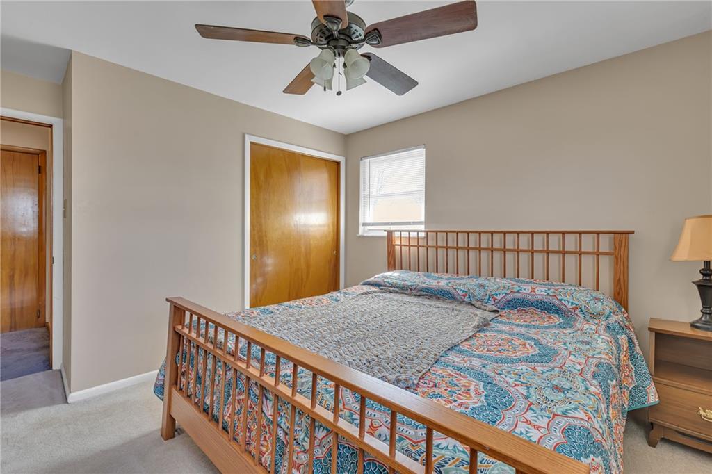 1606 Old Brodhead Road Monaca, PA 15061 - Photo 31 of 37 a bedroom with a bed and a chandelier