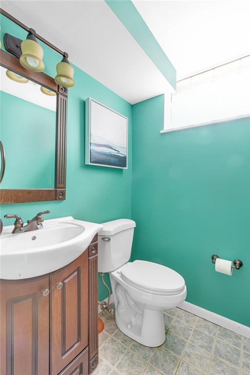 1606 Old Brodhead Road Monaca, PA 15061 - Photo 36 of 37 a bathroom with a toilet sink and mirror