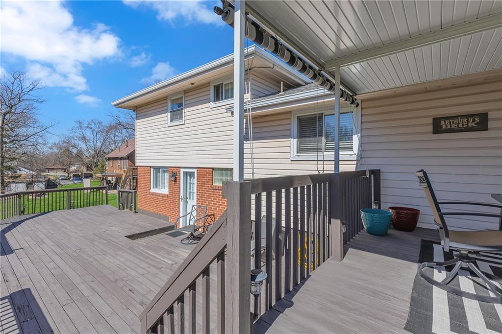 1606 Old Brodhead Road Monaca, PA 15061 - Photo 8 of 37 a view of a roof deck with wooden floor and fence