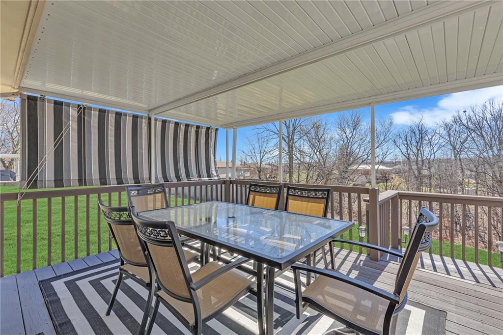 1606 Old Brodhead Road Monaca, PA 15061 - Photo 10 of 37 a view of balcony with wooden floor outdoor seating and yard in the back