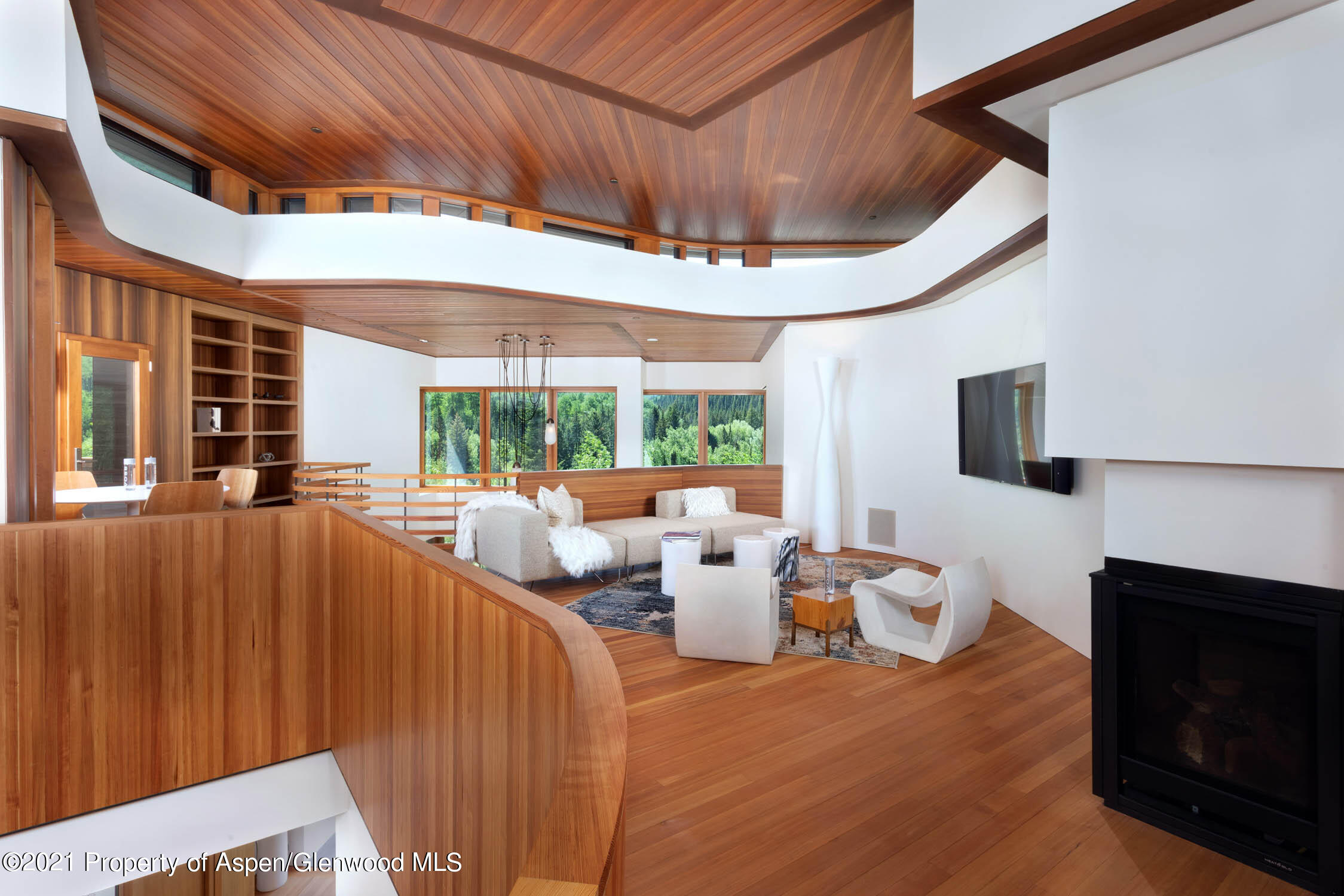 255 Conundrum Creek Road Aspen, CO 81611 - Photo 18 of 70 a living room with furniture a large window and a fireplace