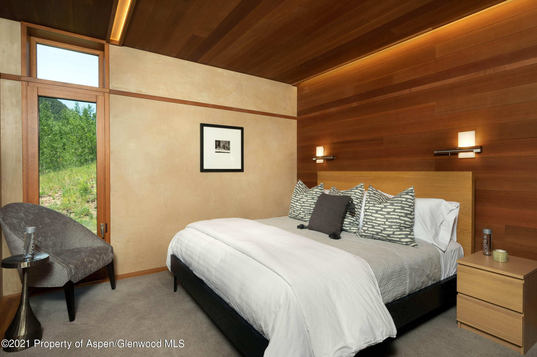 255 Conundrum Creek Road Aspen, CO 81611 - Photo 26 of 70 a bedroom with a bed and wooden floor