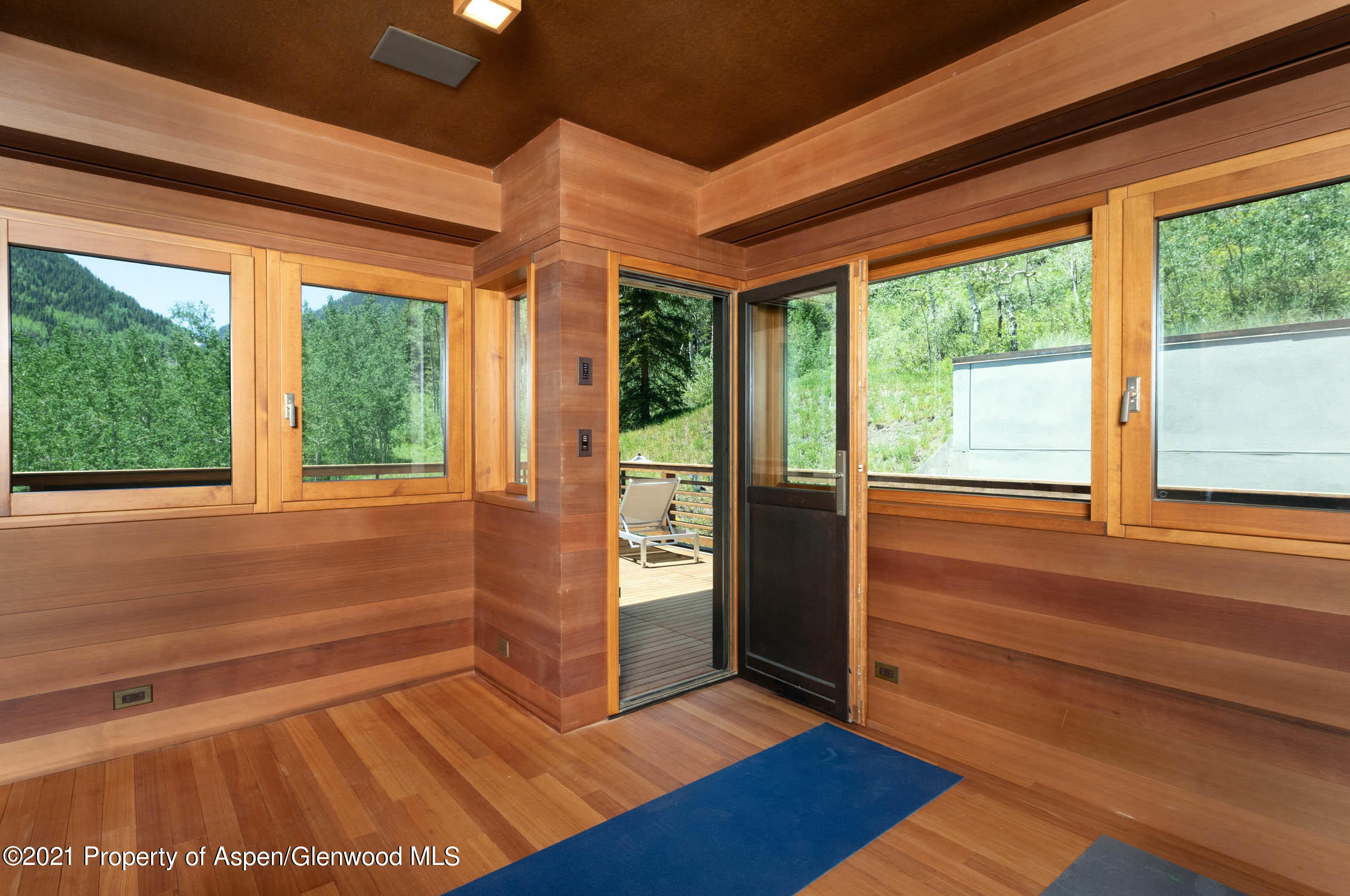 255 Conundrum Creek Road Aspen, CO 81611 - Photo 39 of 70 a view of empty room with wooden floor and fan
