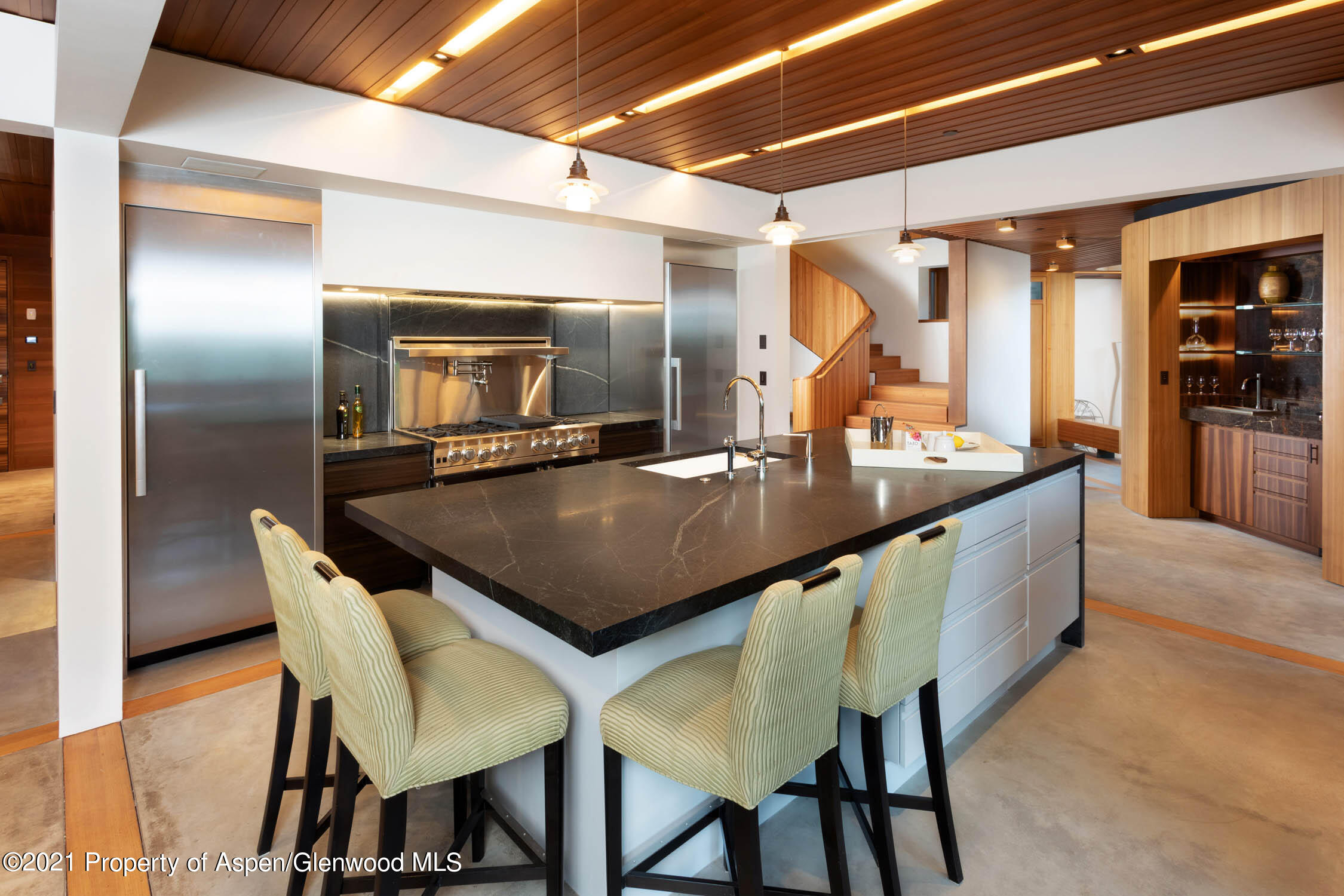 255 Conundrum Creek Road Aspen, CO 81611 - Photo 52 of 70 a kitchen with a table and chairs