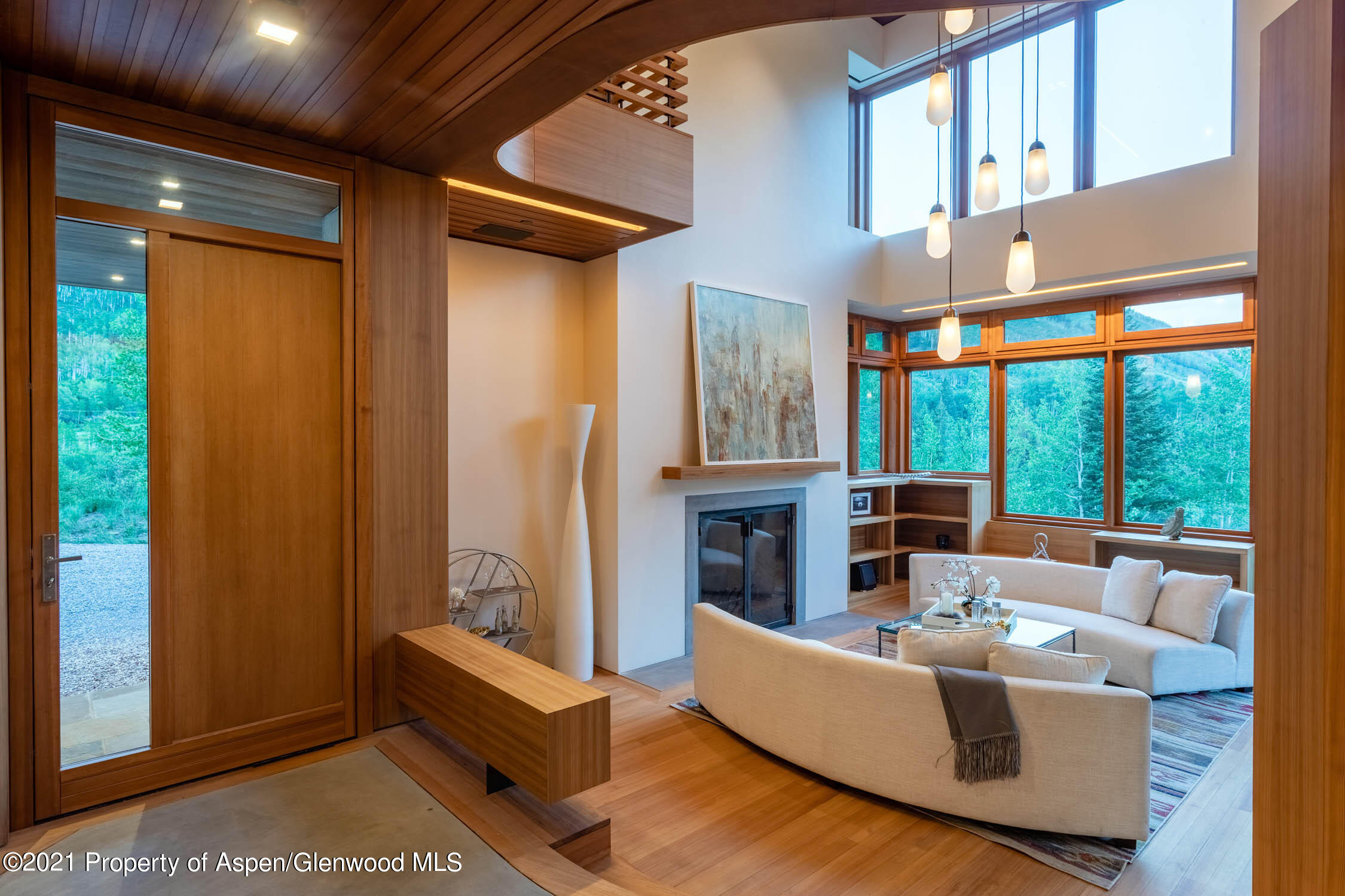 255 Conundrum Creek Road Aspen, CO 81611 - Photo 62 of 70 a living room with furniture a large window and a fireplace