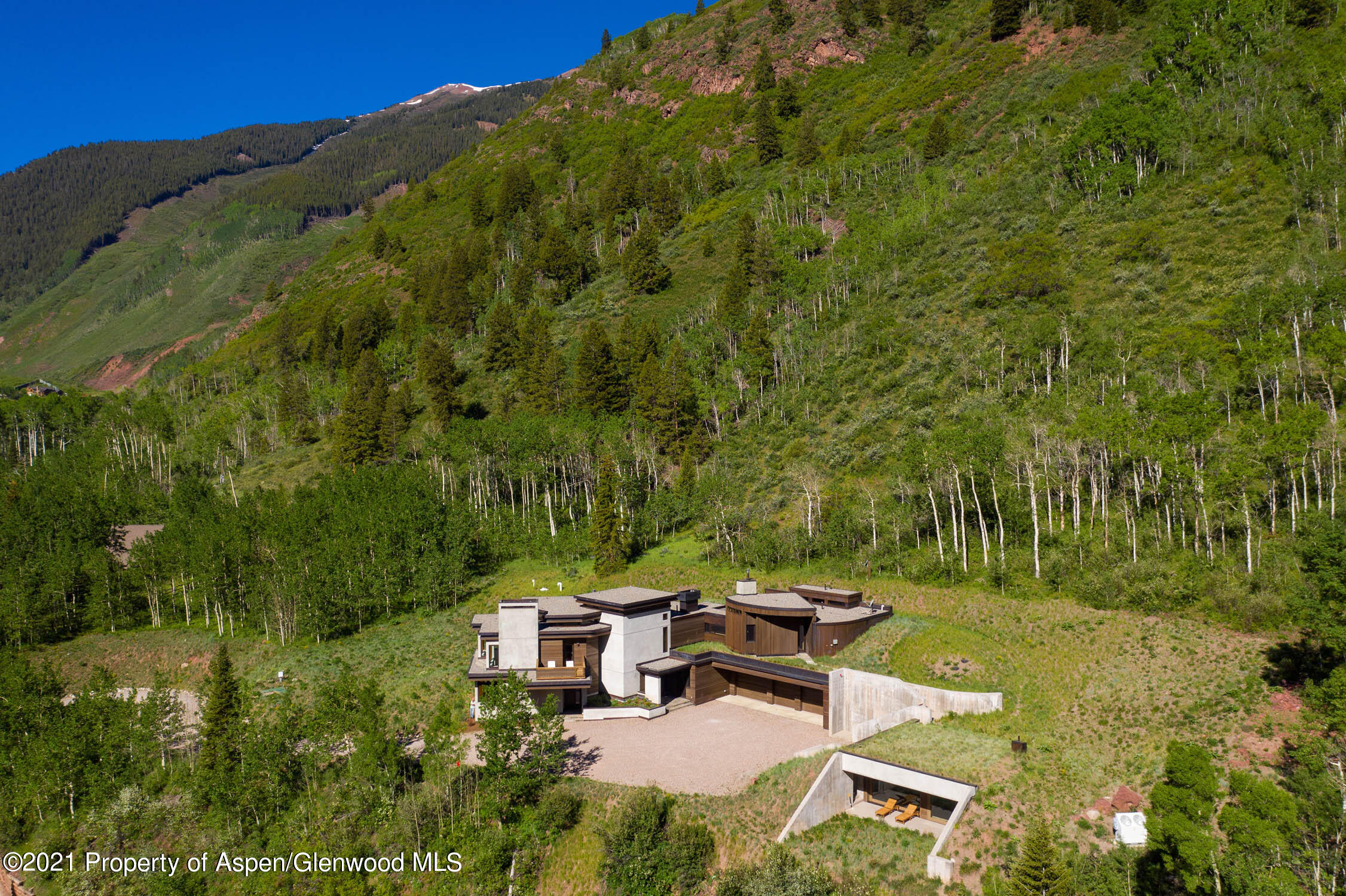 255 Conundrum Creek Road Aspen, CO 81611 - Photo 69 of 70 a view of a backyard with plants and outdoor seating