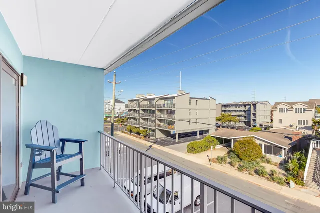 a bedroom with a large bed and a flat screen tv
