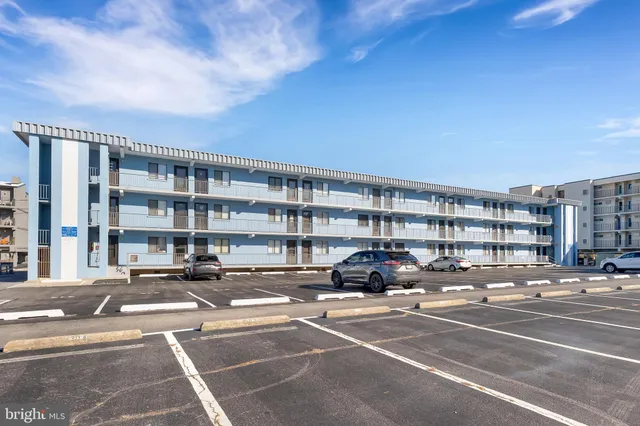 a bathroom with a toilet and a mirror