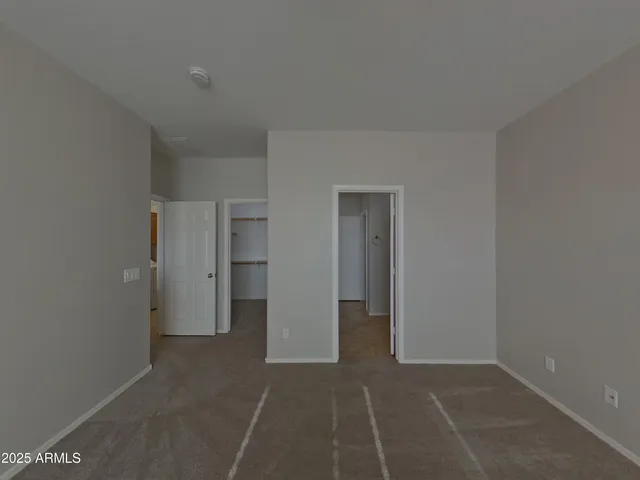 a large kitchen with stainless steel appliances a stove a sink and a refrigerator