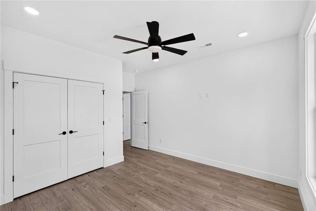 424 Blume Road Anderson, SC 29625 - Photo 25 of 30 A well-lit bedroom with modern wood-look flooring and a contemporary ceiling fan offers a comfortable retreat.