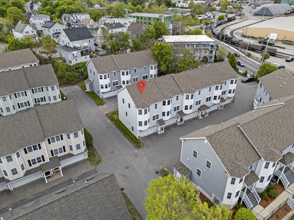 50 Des Moines Road, Unit H1 Quincy, MA 02169 - Photo 31 of 40 an aerial view of a house with outdoor space