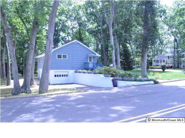 1140 Ivy Road Manasquan, NJ 08736 - Photo 2 of 3 a view of a house with backyard and tree