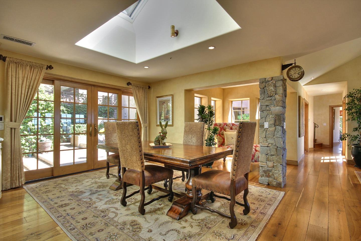 15668 Bohlman Road Saratoga, CA 95070 - Photo 13 of 33 a view of a dining room with furniture wooden floor and a rug