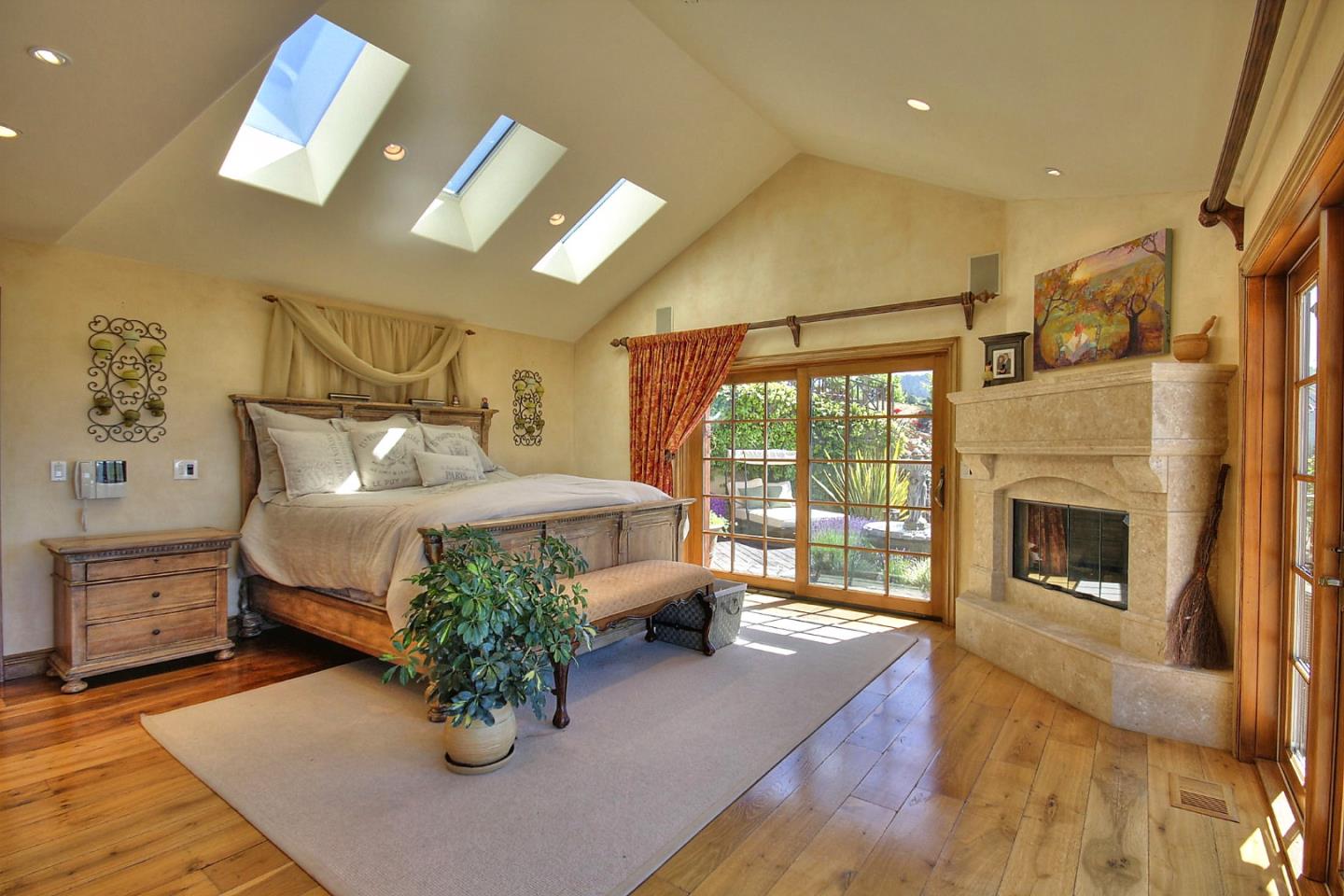 15668 Bohlman Road Saratoga, CA 95070 - Photo 14 of 33 a bed room with furniture and a fireplace