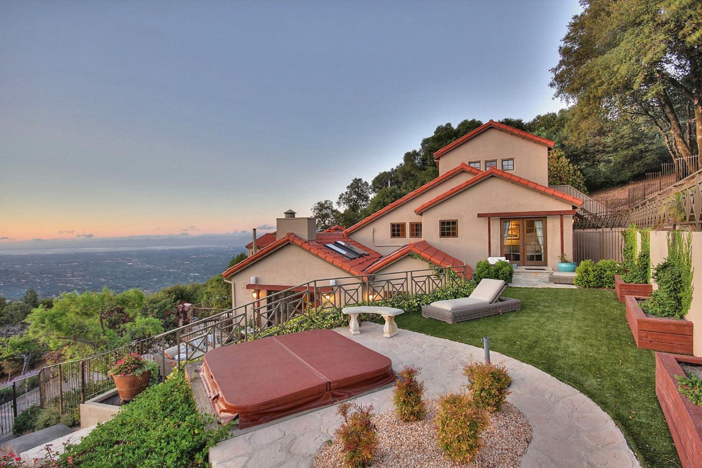 15668 Bohlman Road Saratoga, CA 95070 - Photo 2 of 33 a front view of a house with garden