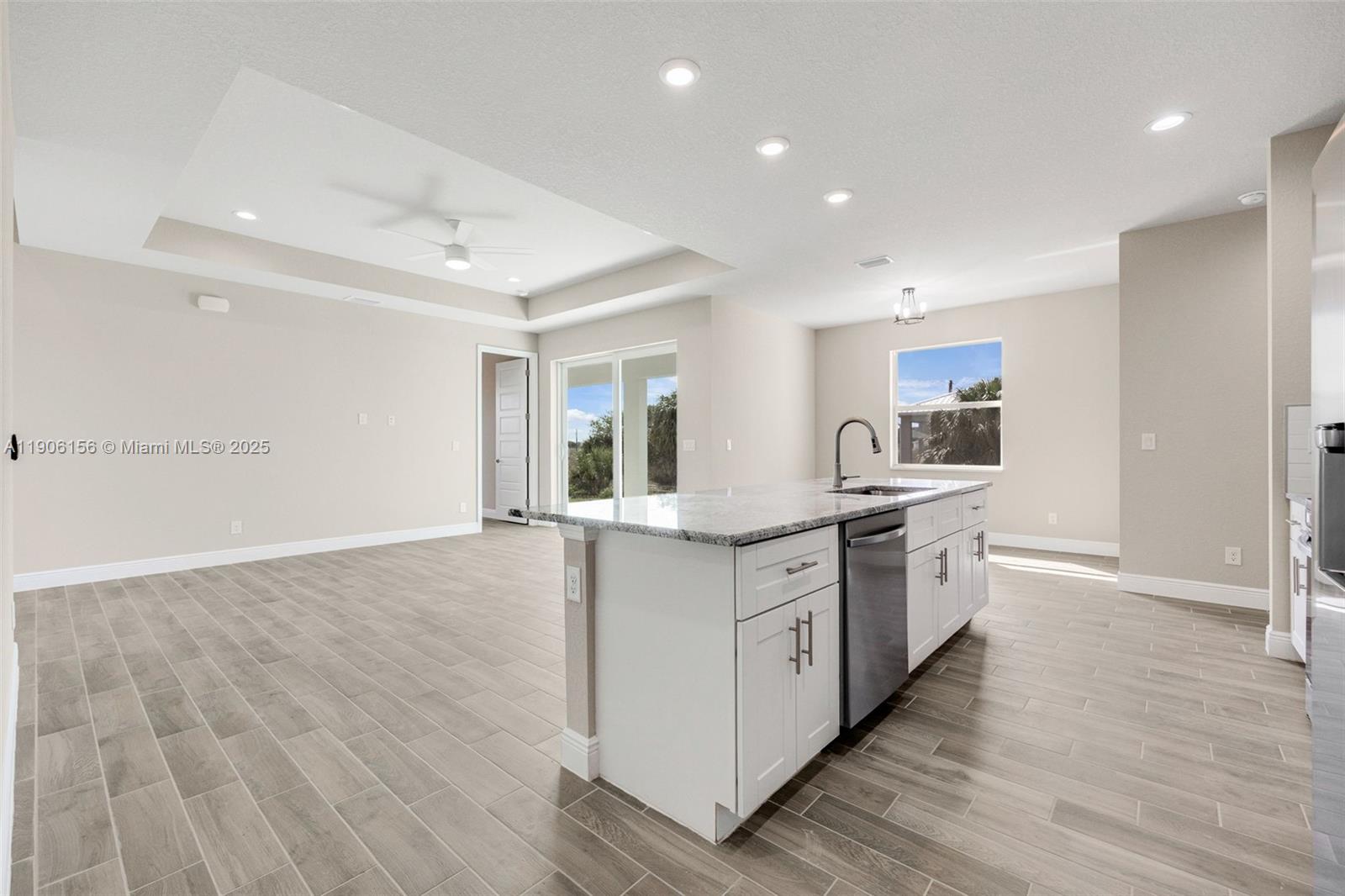 626 Royce Road LaBelle, FL 33935 - Photo 12 of 40 a large kitchen with granite countertop a large counter top space stainless steel appliances and cabinets