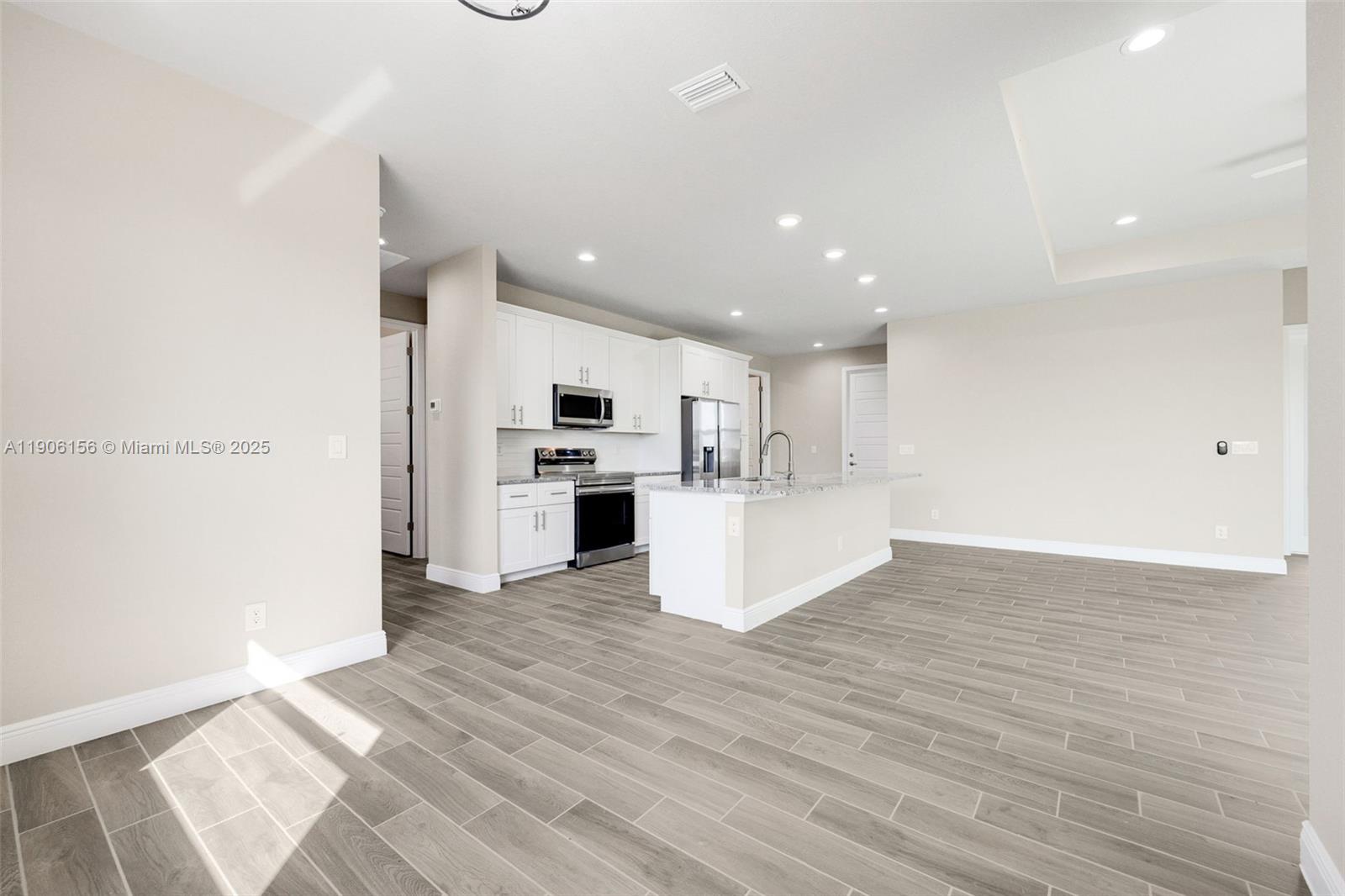 626 Royce Road LaBelle, FL 33935 - Photo 16 of 40 a view of kitchen with wooden floor