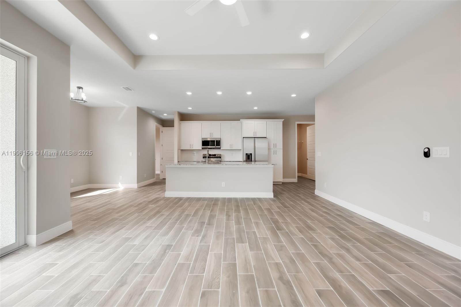 626 Royce Road LaBelle, FL 33935 - Photo 6 of 40 a view of a kitchen with wooden floor