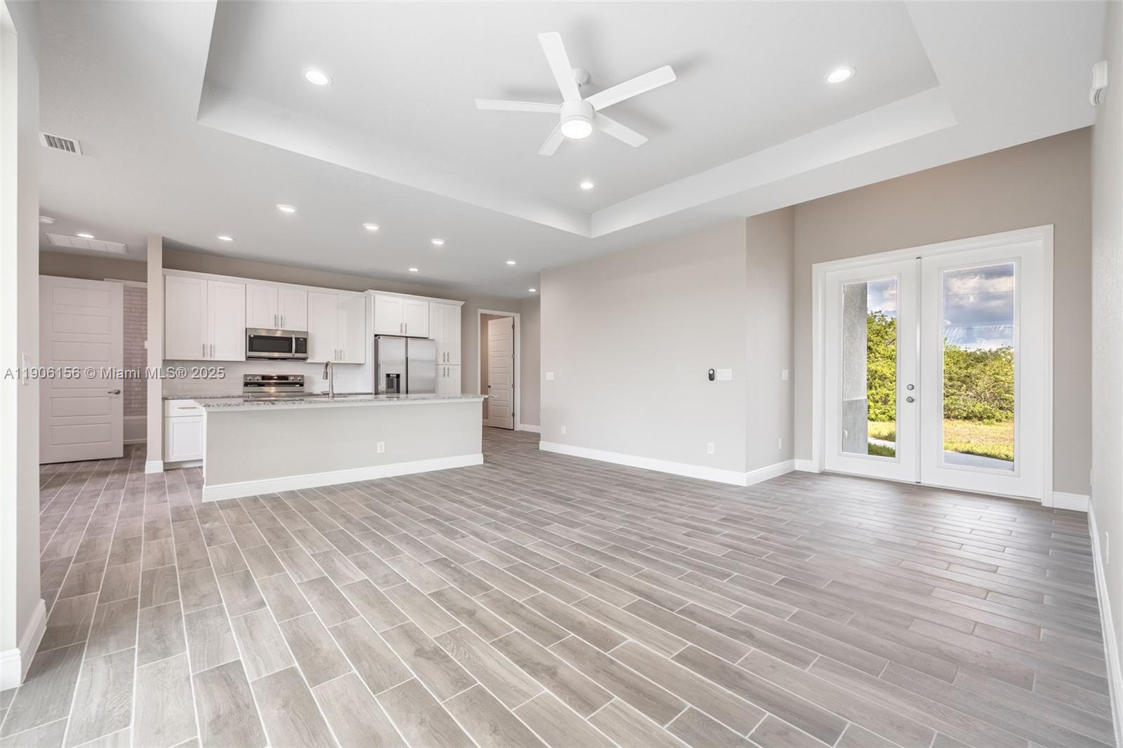 626 Royce Road LaBelle, FL 33935 - Photo 7 of 40 a view of kitchen with wooden floor and window