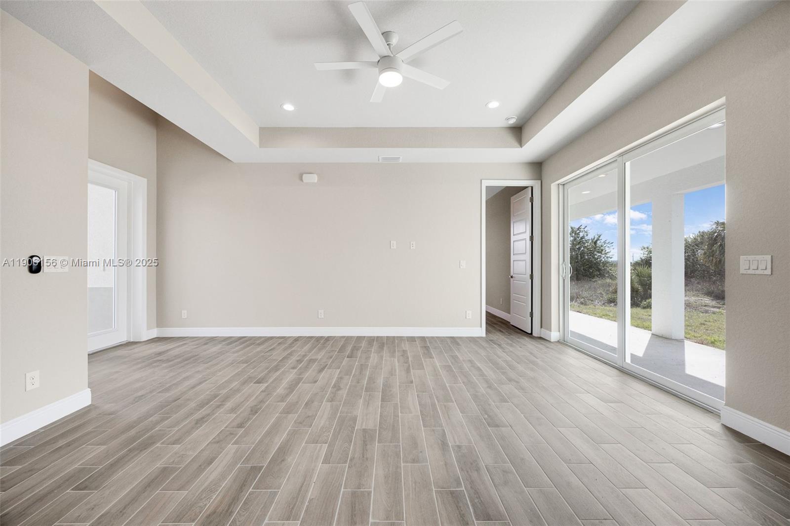 626 Royce Road LaBelle, FL 33935 - Photo 8 of 40 a view of an empty room with glass door