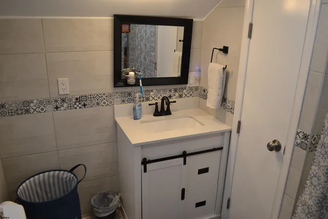 a bathroom with a sink and a mirror