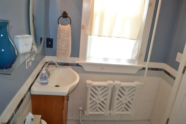 a bathroom with a bathtub and a window