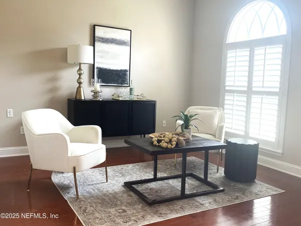 a living room with furniture and a window