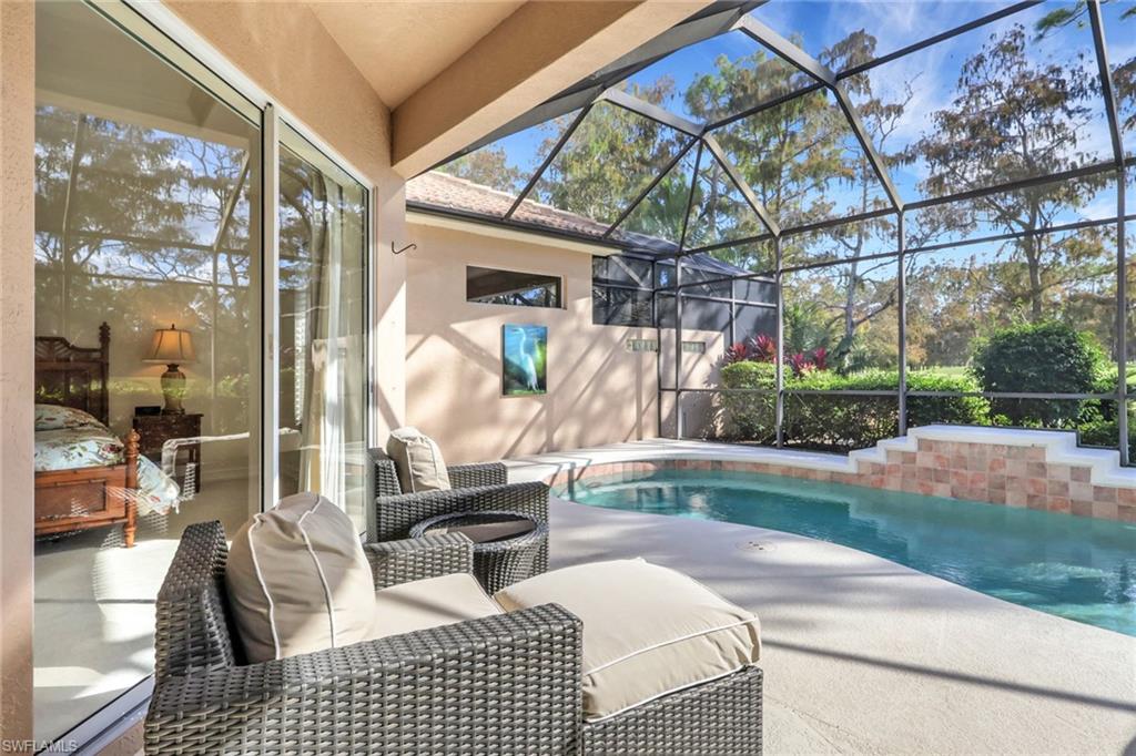 3134 Santorini Court Naples, FL 34119 - Photo 19 of 21 a room with lots of furniture and a rug