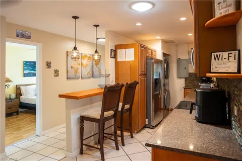 a view of a kitchen and dining room