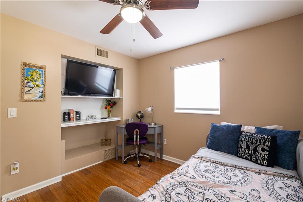 806 97th Avenue North Naples, FL 34108 - Photo 25 of 27 a bedroom with a workspace