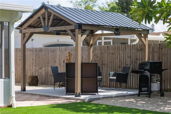 a front view of house with a garden