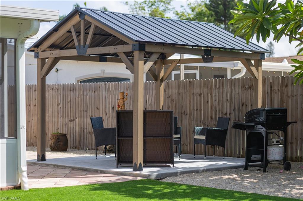 806 97th Avenue North Naples, FL 34108 - Photo 6 of 27 a front view of house with a garden