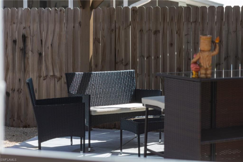 806 97th Avenue North Naples, FL 34108 - Photo 7 of 27 a view of outdoor space with seating area
