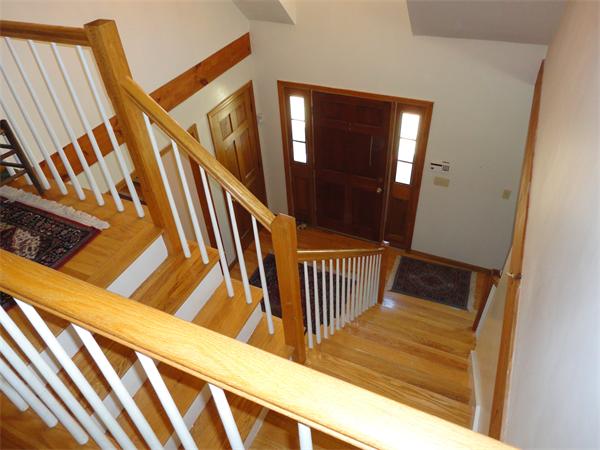 107 Leslie Road Rowley, MA 01969 - Photo 9 of 13 a view of staircase with railing and white walls