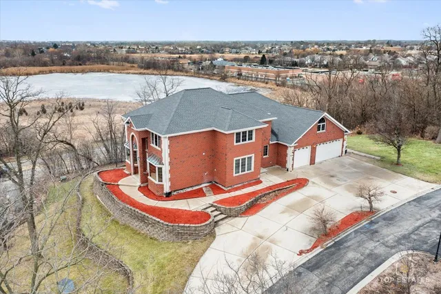 a view of a brick house with a door and a window