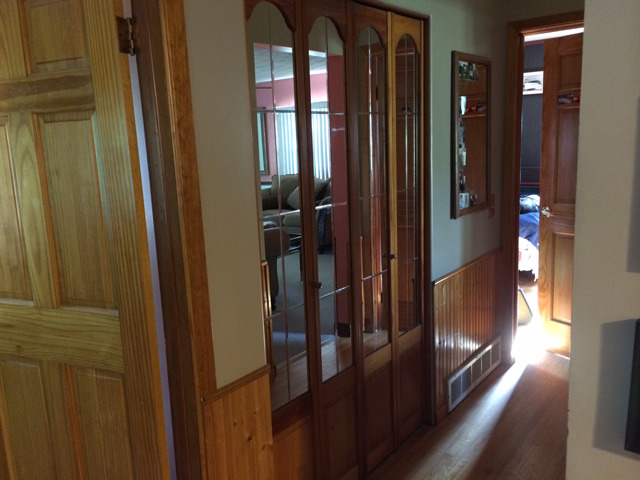 509 West 4th Street Spring Valley, IL 61362 - Photo 4 of 8 a view of a hallway with wooden floor and windows