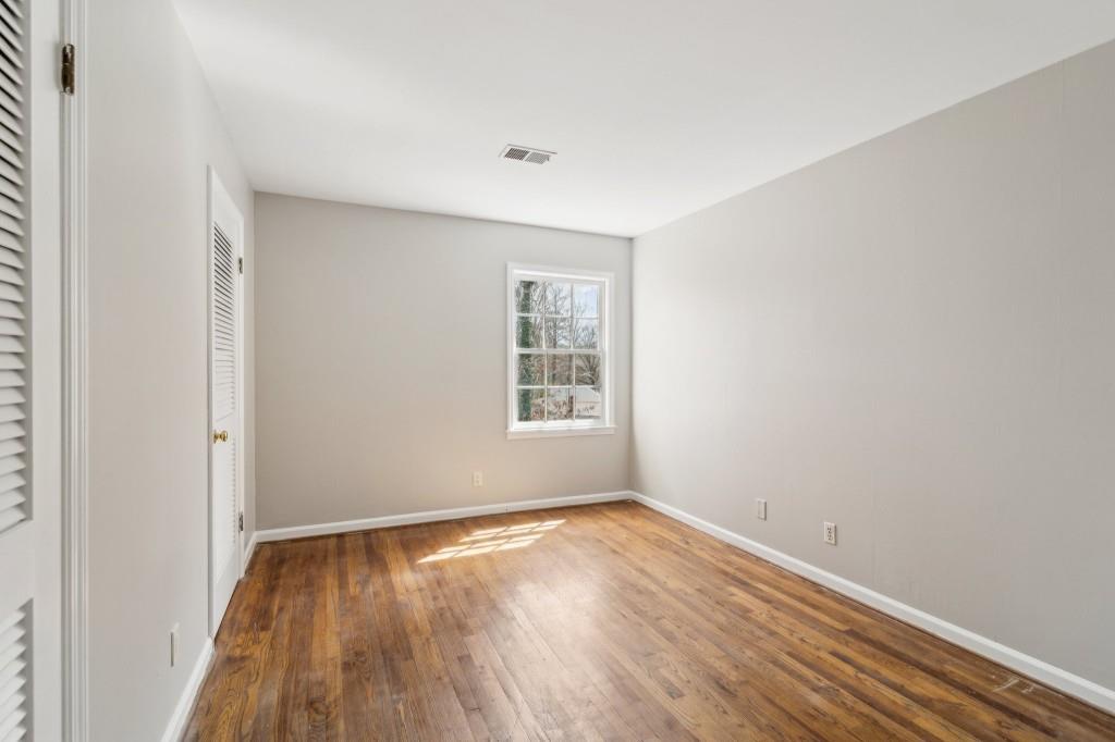 355 Westerhall Court Sandy Springs, GA 30328 - Photo 20 of 37 a view of a room with wooden floor and window