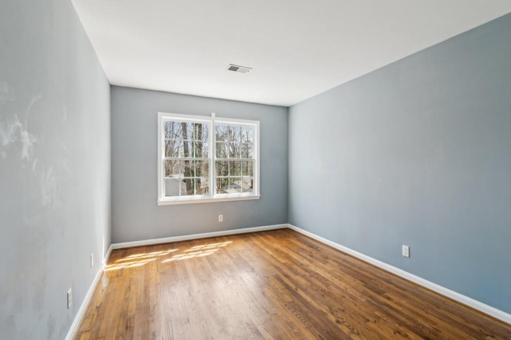 355 Westerhall Court Sandy Springs, GA 30328 - Photo 26 of 37 wooden floor in an empty room with a window