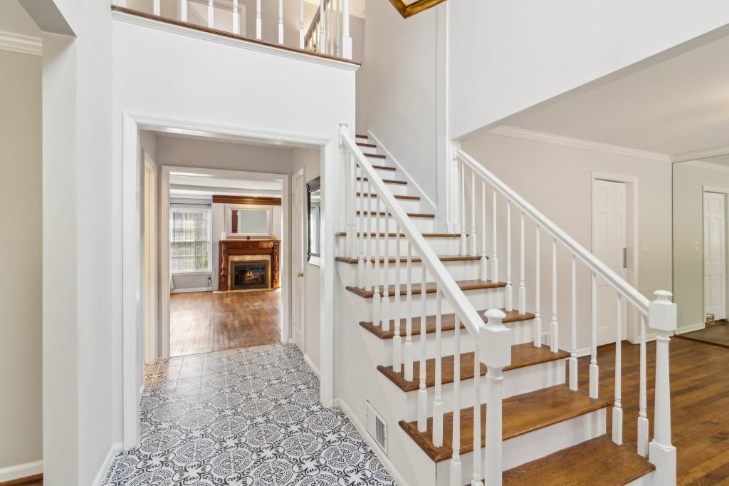 355 Westerhall Court Sandy Springs, GA 30328 - Photo 4 of 37 a view of staircase with white walls and wooden floor