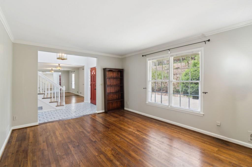 355 Westerhall Court Sandy Springs, GA 30328 - Photo 6 of 37 an empty room with wooden floor and a window