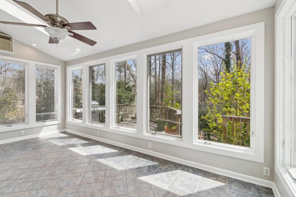 355 Westerhall Court Sandy Springs, GA 30328 - Photo 9 of 37 a view of a livingroom with a floor to ceiling window and wooden floor