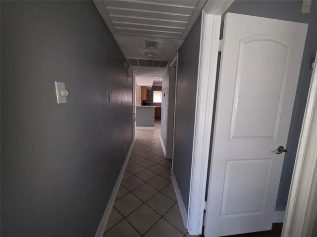 a view of a hallway view with staircase